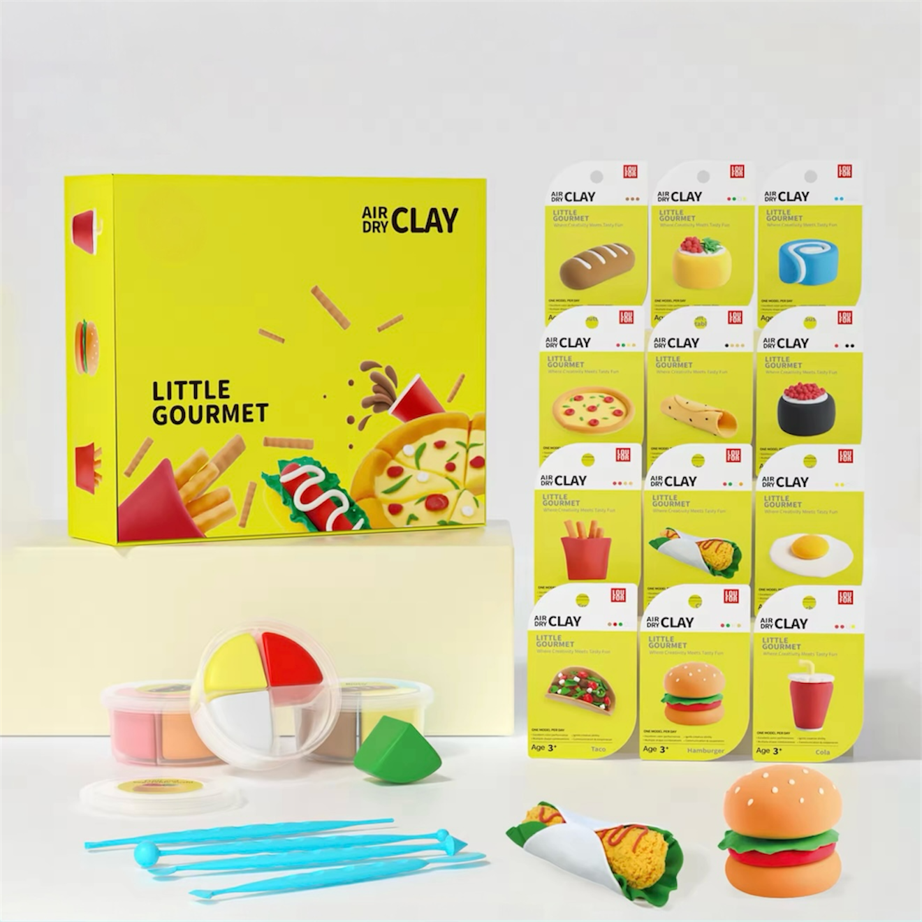 Little Gourmet Air Dry Clay Kit featuring colorful food-themed creations like burgers, tacos, and pizza. This Montessori-inspired DIY craft set helps kids and adults express creativity through hands-on, screen-free play. Includes 12 tubs of soft air dry clay and sculpting tools — the perfect educational and mindful gift for birthdays, holidays, or family bonding moments full of imagination and joy.